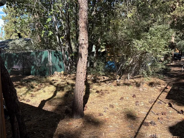 a view of a wooden fence with snow