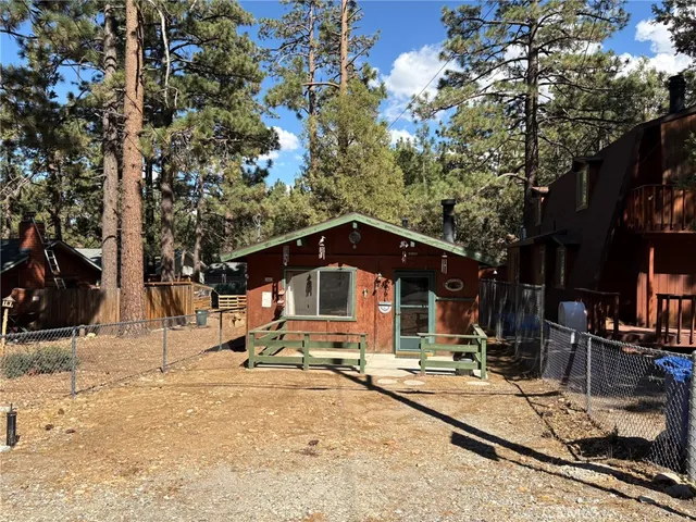 a view of a house with snow on the road