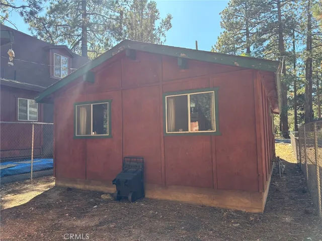 a backyard of a house with yard and outdoor seating