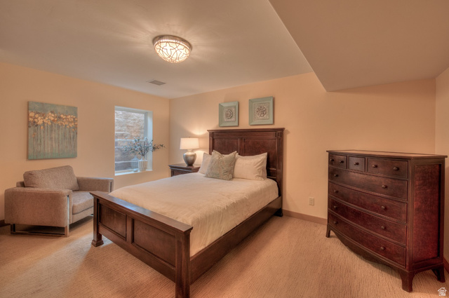 425 Amber Lane Moab, UT 84532 - Photo 13 of 27 Bedroom with light carpet and baseboards