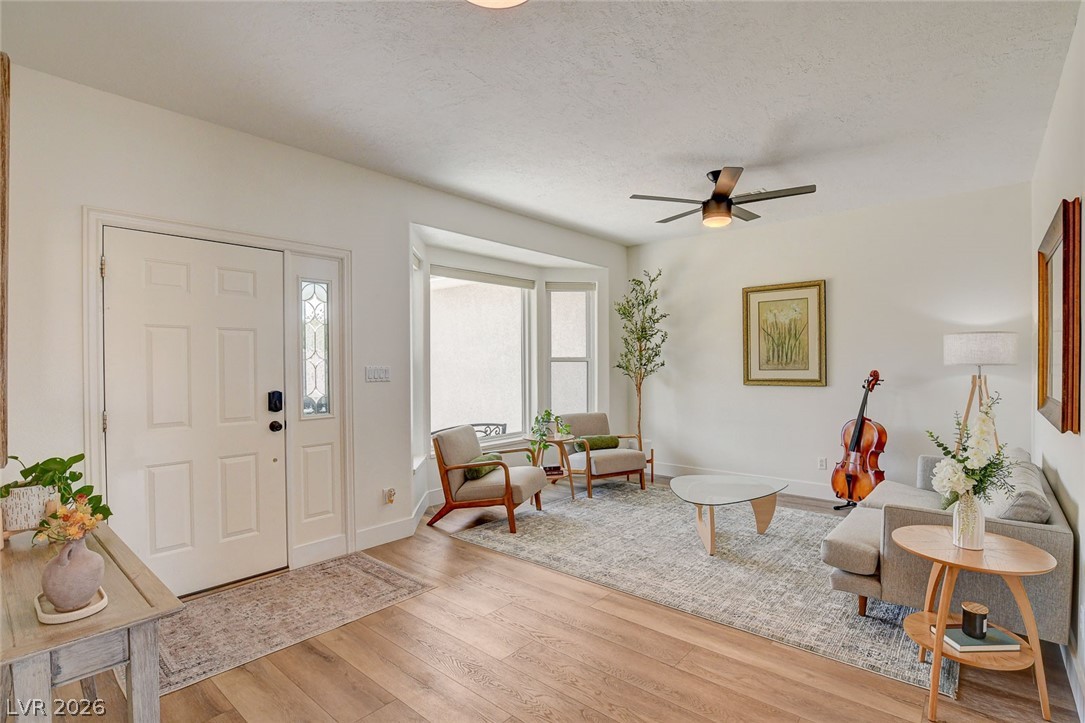 4362 Thistle Street Logandale, NV 89021 - Photo 7 of 99 LVP and bay windows enhance this airy and inviting living room.
