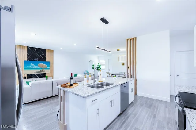 a dining room with wooden floor a glass table and chairs