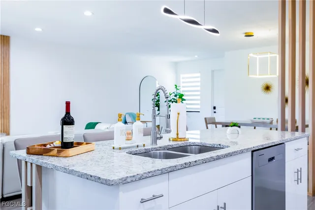 a bed room with a bed and a chandelier