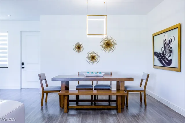 a bedroom with a bed and a wooden floor