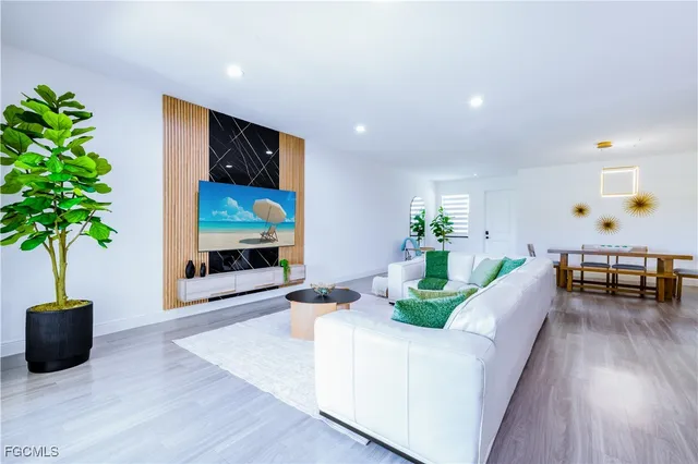 a kitchen with granite countertop a sink and a stove top oven