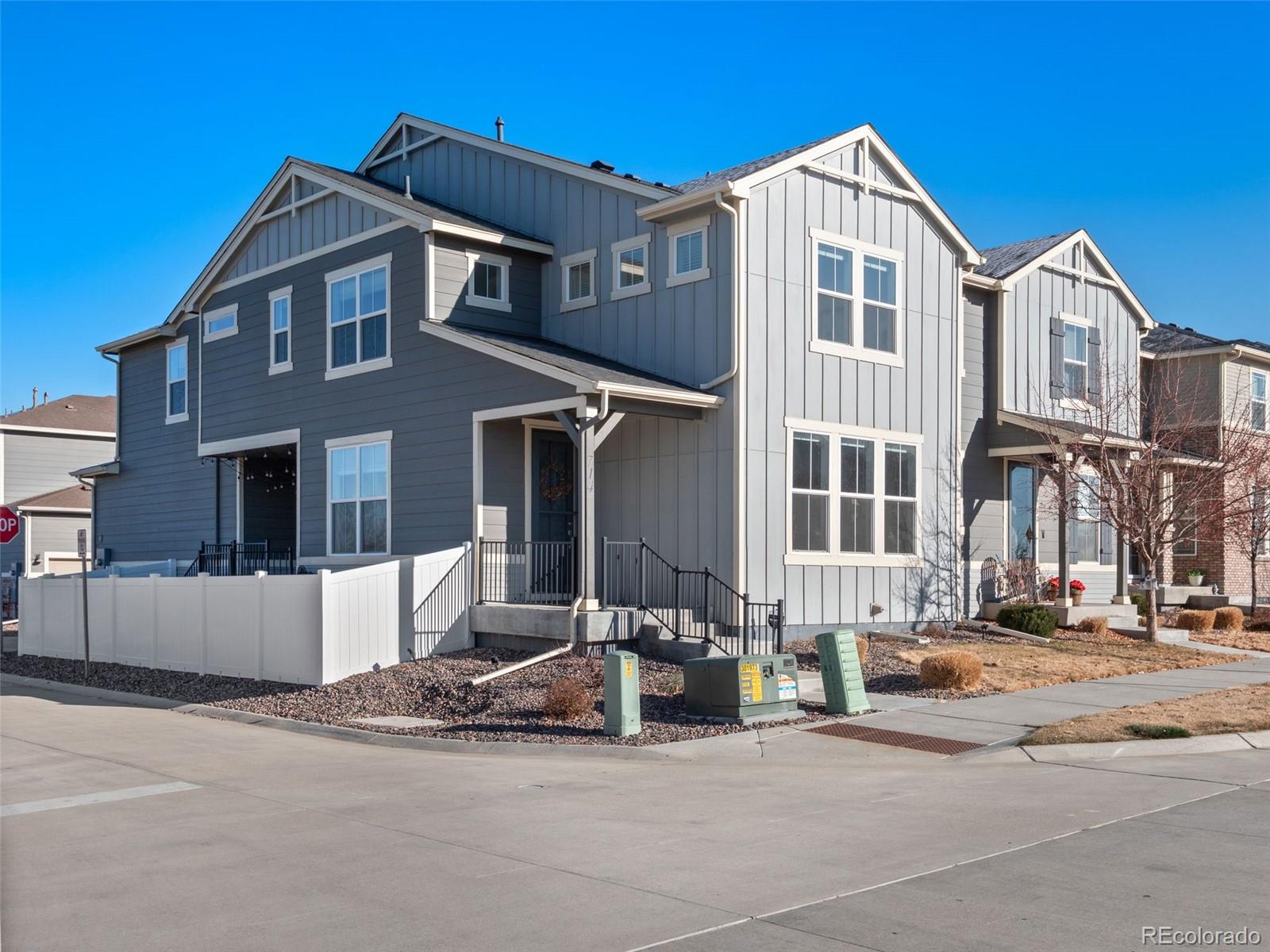 714 Prairie Clover Way Brighton, CO 80640 - Photo 3 of 41 a front view of a house with a yard