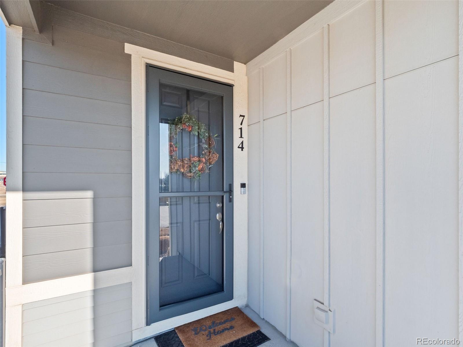 714 Prairie Clover Way Brighton, CO 80640 - Photo 4 of 41 a view of wooden door