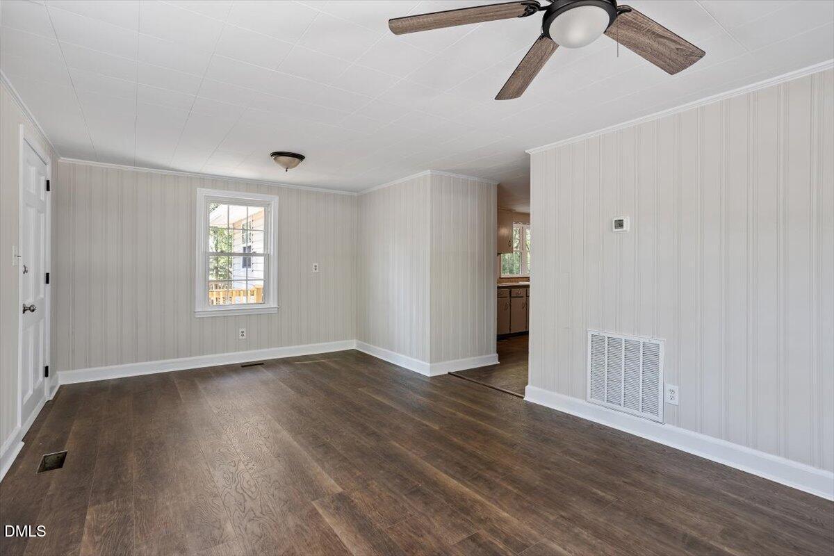 2008 Angier Road Fuquay-Varina, NC 27526 - Photo 13 of 34 wooden floor in an empty room with a window