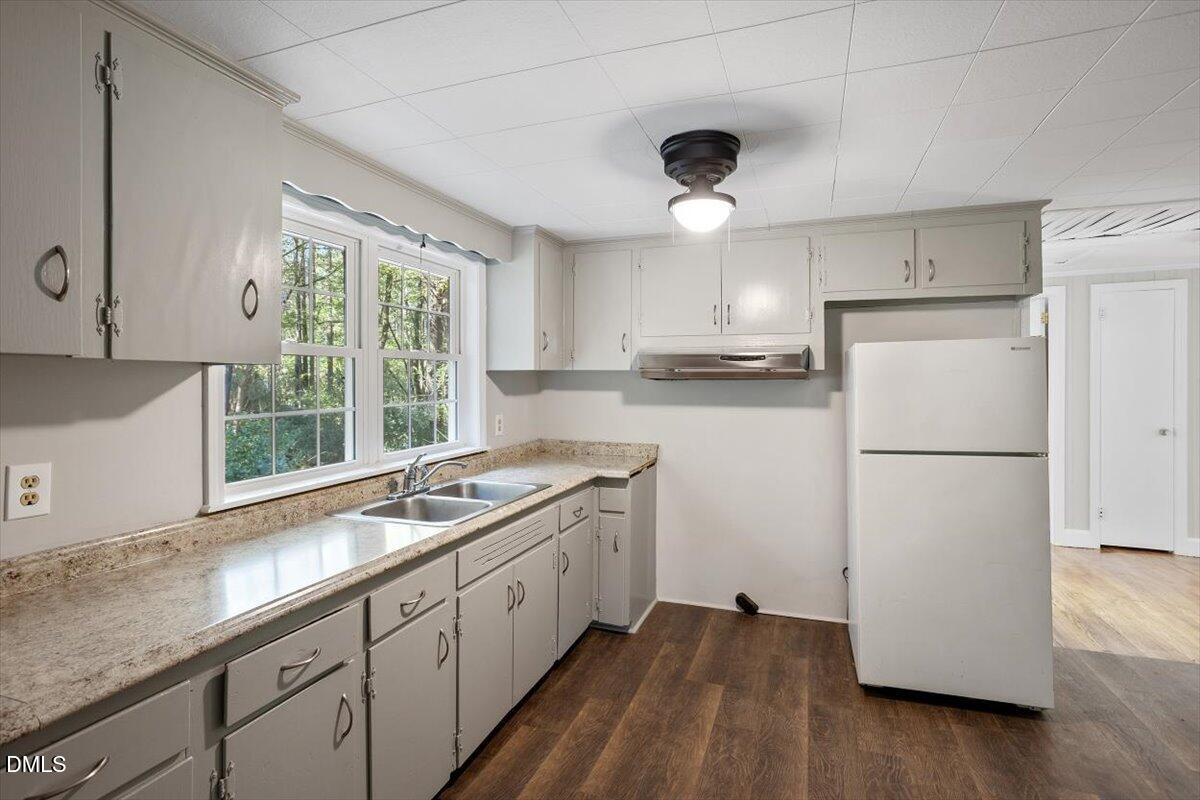2008 Angier Road Fuquay-Varina, NC 27526 - Photo 16 of 34 a kitchen with a sink a refrigerator and window