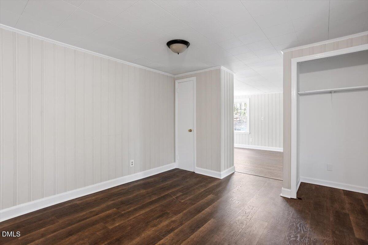 2008 Angier Road Fuquay-Varina, NC 27526 - Photo 18 of 34 a view of an empty room with wooden floor