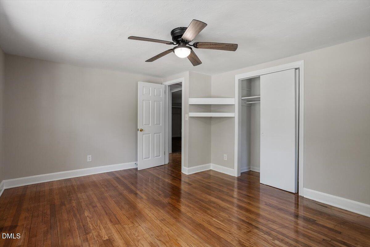 2008 Angier Road Fuquay-Varina, NC 27526 - Photo 20 of 34 a view of empty room with wooden floor and ceiling fan