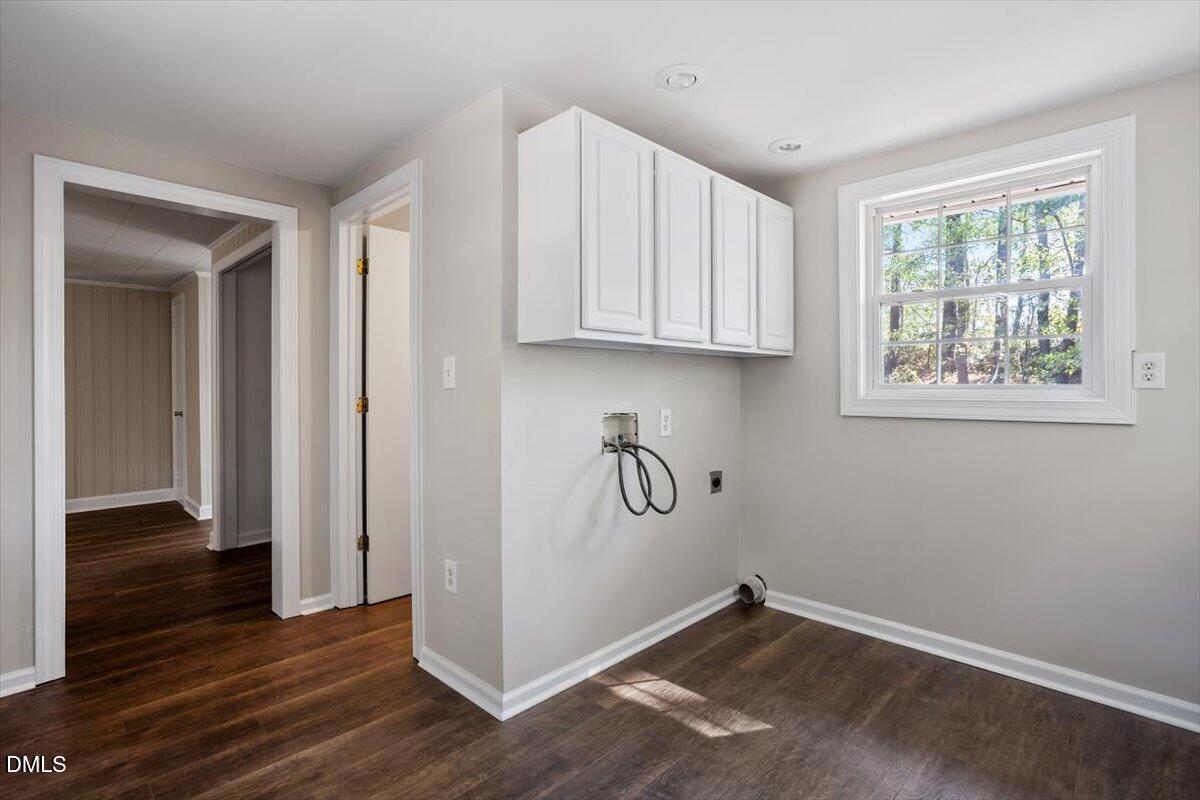 2008 Angier Road Fuquay-Varina, NC 27526 - Photo 27 of 34 an empty room with wooden floor and a window