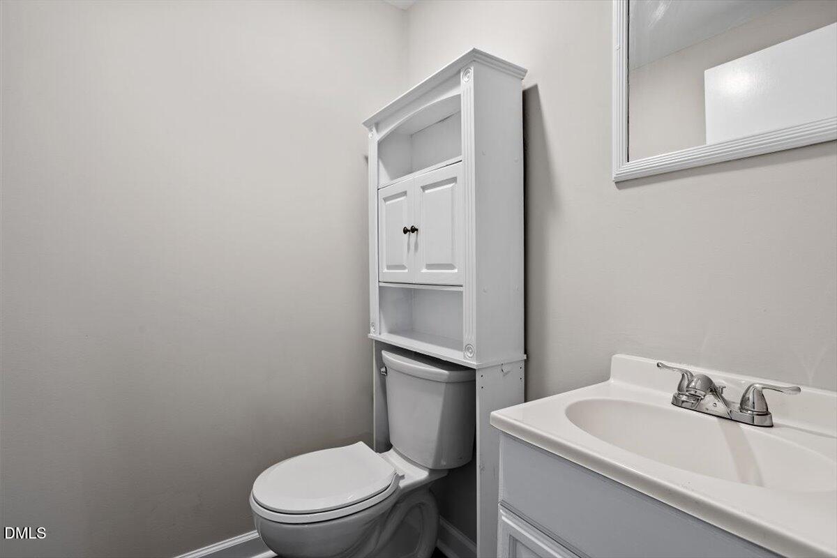 2008 Angier Road Fuquay-Varina, NC 27526 - Photo 28 of 34 a white toilet sitting next to a bathroom sink