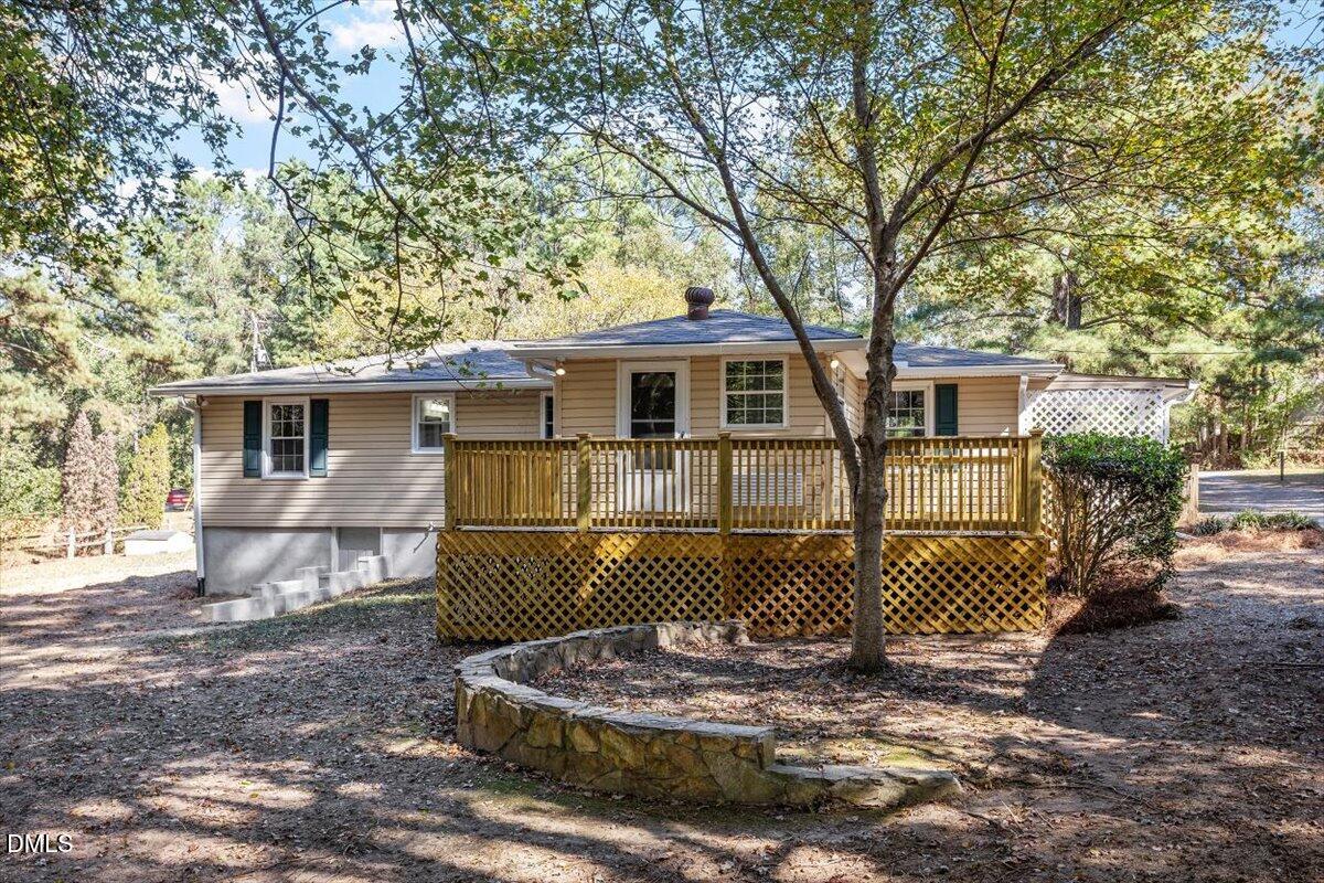 2008 Angier Road Fuquay-Varina, NC 27526 - Photo 30 of 34 a front view of a house with a tree