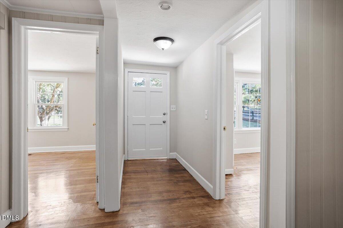 2008 Angier Road Fuquay-Varina, NC 27526 - Photo 9 of 34 a view of a hallway with wooden floor and closet