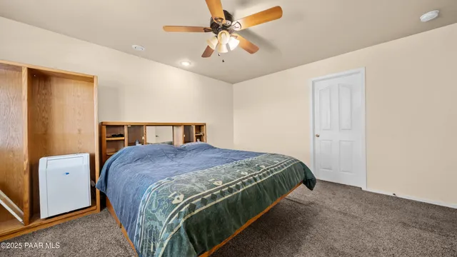 a view of a backyard with plants and a patio