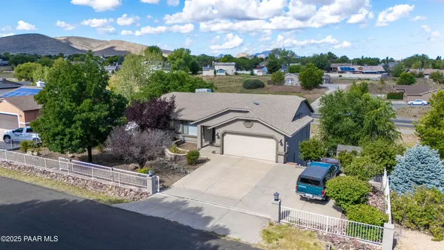 a kitchen with stainless steel appliances a refrigerator sink and cabinets