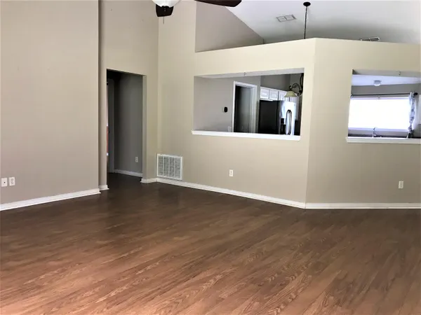a view of a livingroom with wooden floor