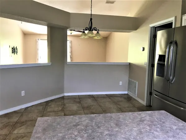 a view of a kitchen with a sink and dishwasher