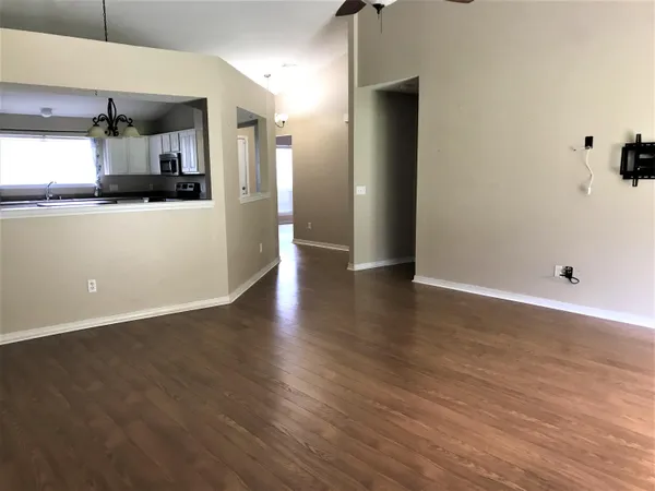a view of a kitchen from the hallway