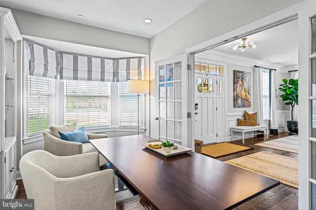 a kitchen with stainless steel appliances granite countertop a refrigerator a stove and a sink