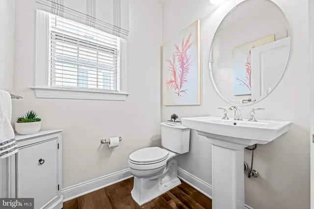 a kitchen with granite countertop a sink stove and refrigerator