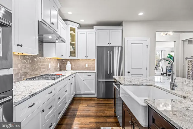 a room with a walk in closet and wooden floor
