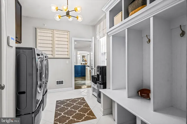a view of a hallway with wooden floor and stairs