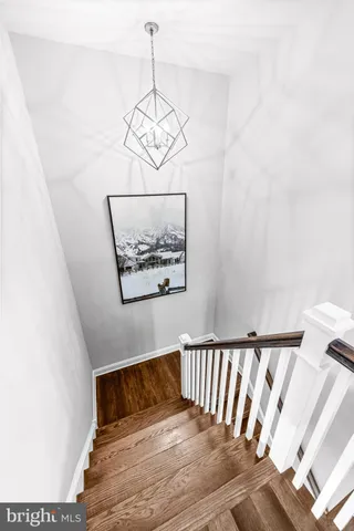 a spacious bathroom with a granite countertop sink mirror and toilet