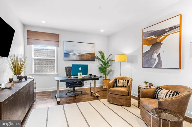 a white bath tub sitting next to a white sink