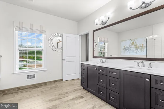 a white toilet sitting next to a bathroom