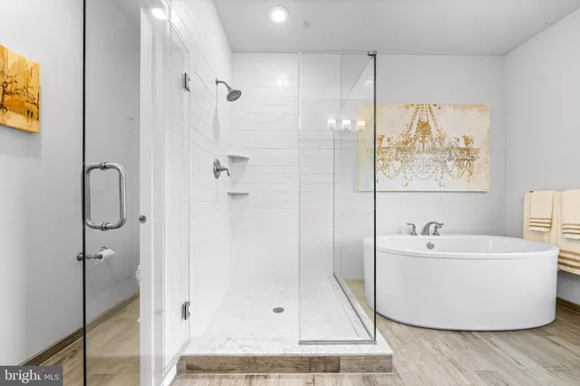 a living room with furniture a rug and a flat screen tv