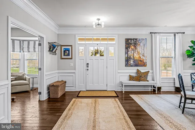 a living room with furniture and large window