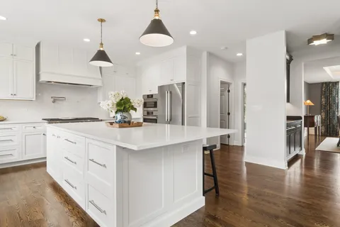 a kitchen with counter top space cabinets and stainless steel appliances