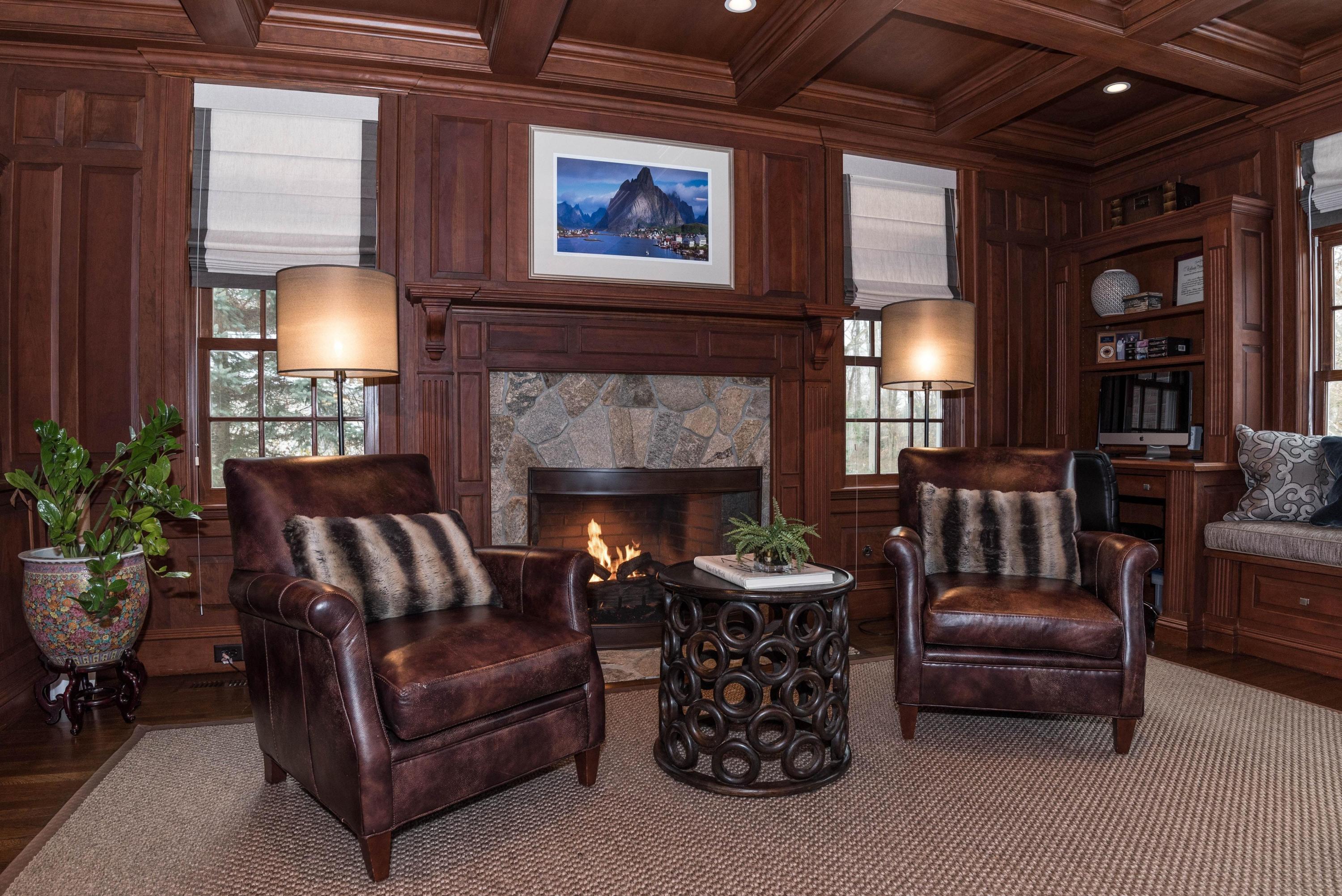 48 Leeuwarden Road Darien, CT 06820 - Photo 14 of 35 a living room with furniture and a fireplace