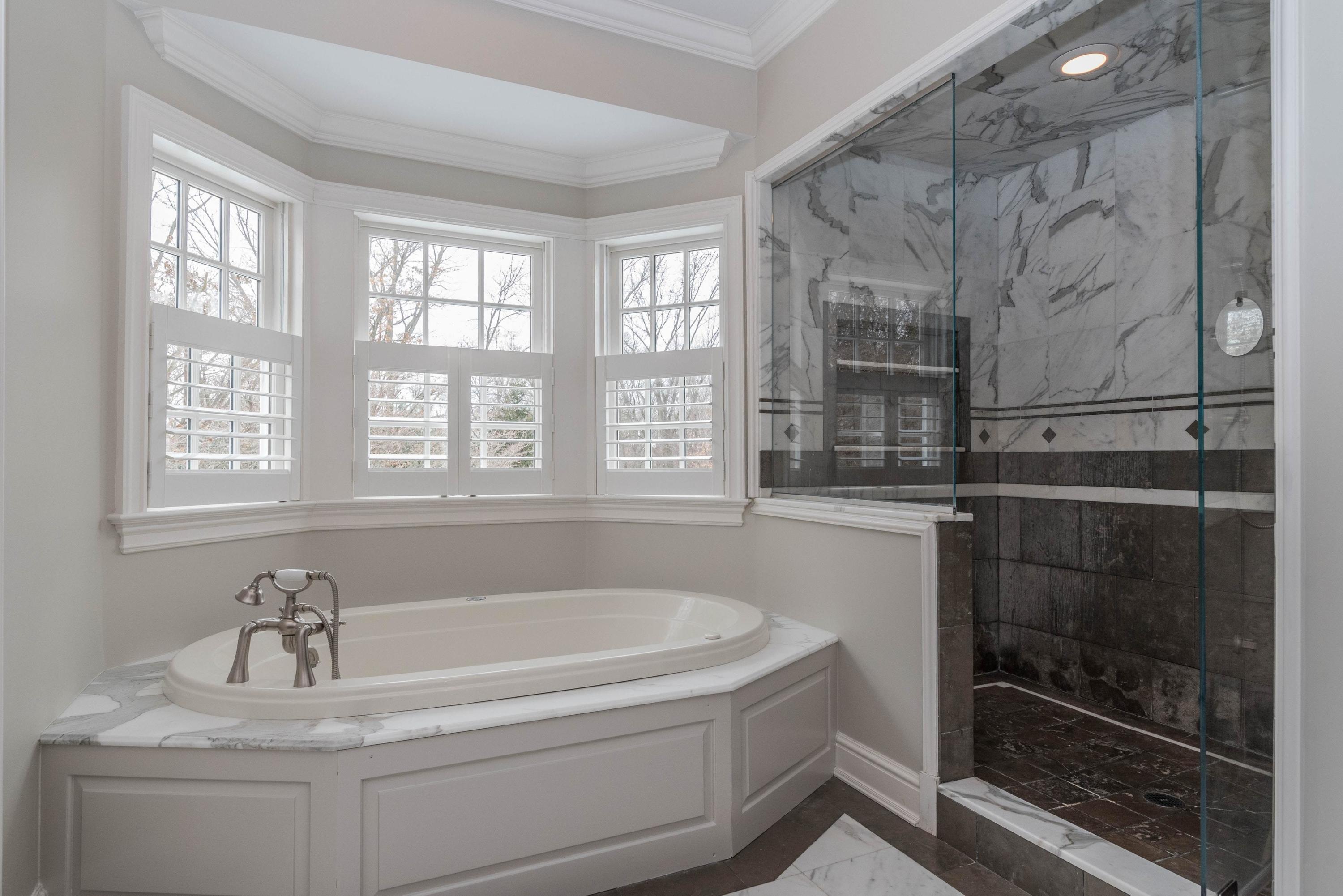 48 Leeuwarden Road Darien, CT 06820 - Photo 17 of 35 a bath tub sitting next to a window