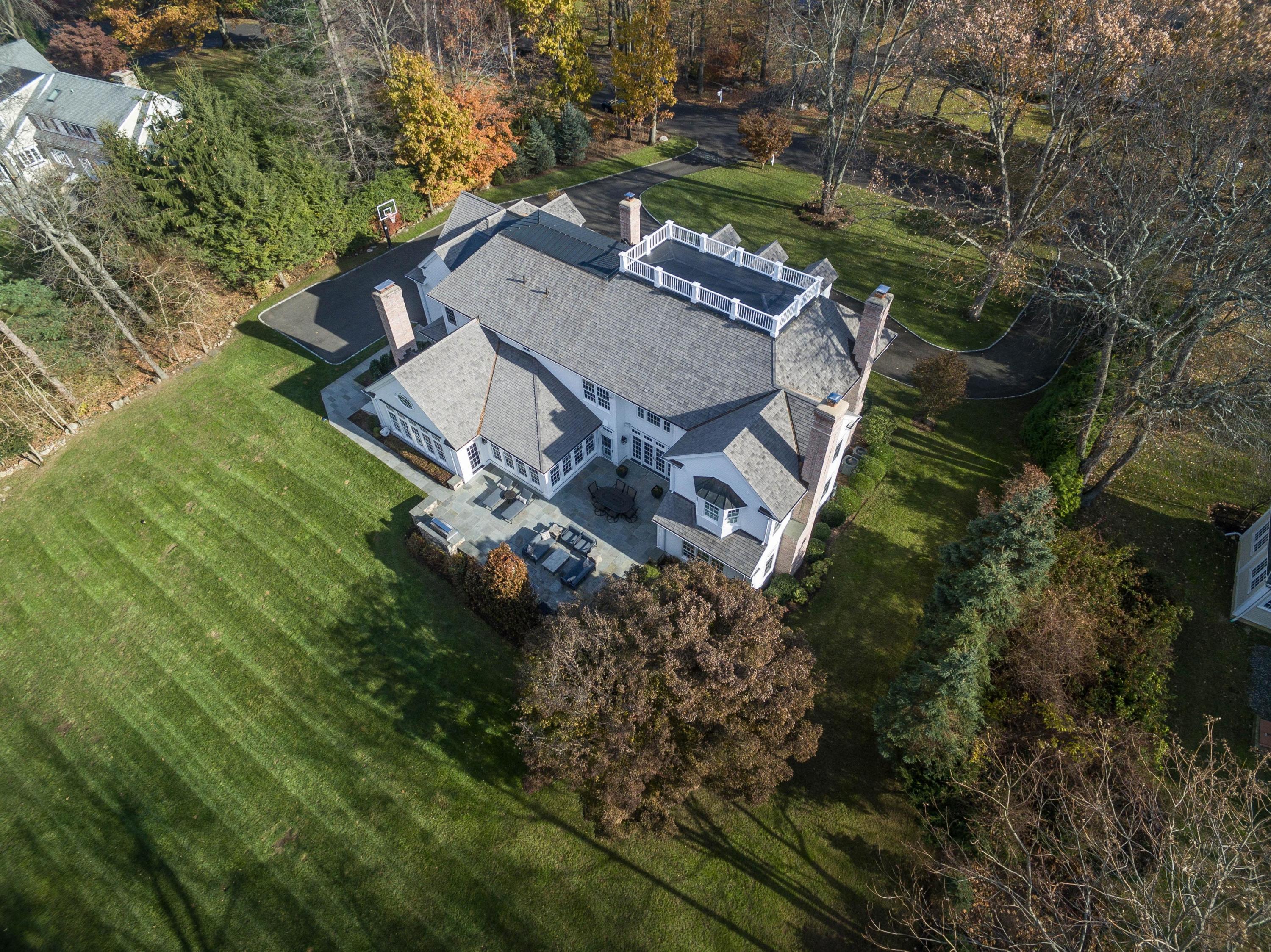 48 Leeuwarden Road Darien, CT 06820 - Photo 2 of 35 a view of a house with a big yard and large trees