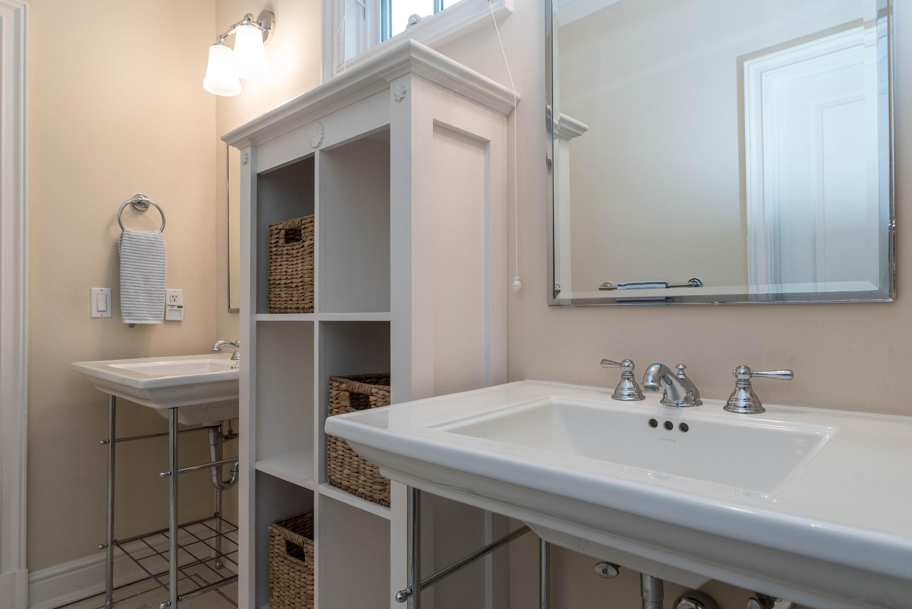 48 Leeuwarden Road Darien, CT 06820 - Photo 21 of 35 a bathroom with a sink and a mirror