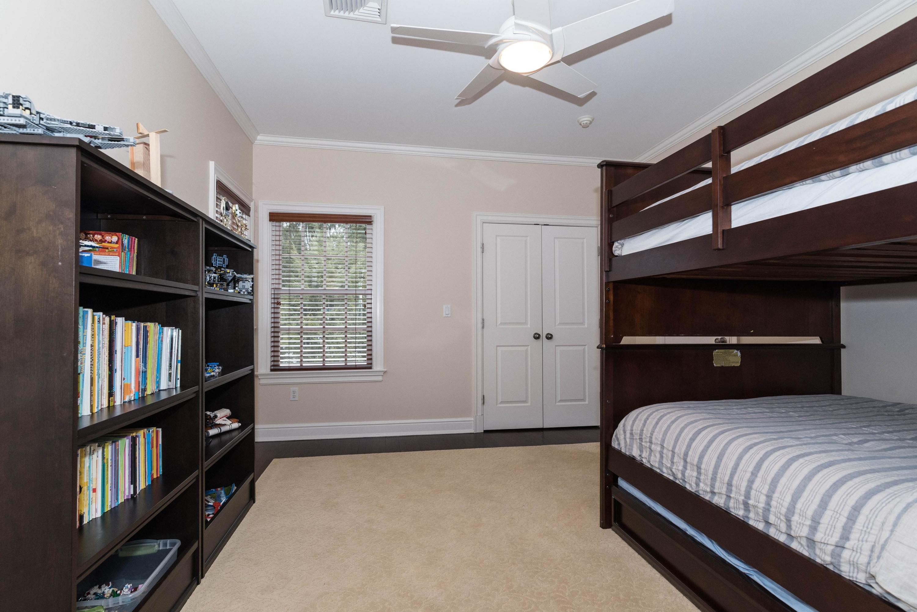 48 Leeuwarden Road Darien, CT 06820 - Photo 22 of 35 a bedroom with a large bed and a window