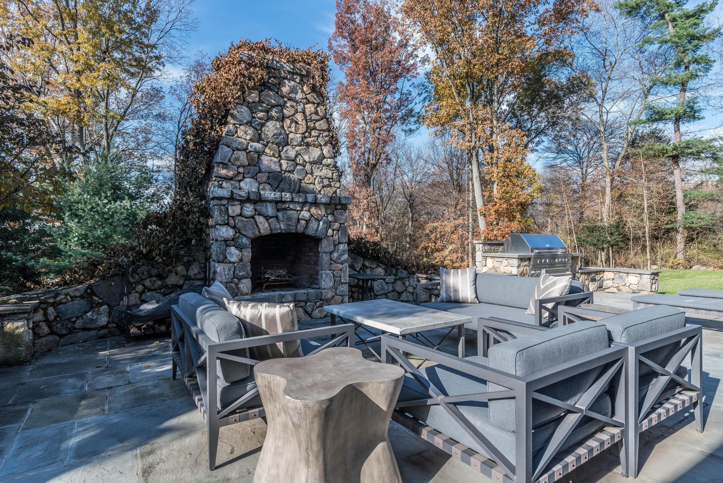 48 Leeuwarden Road Darien, CT 06820 - Photo 30 of 35 a view of a patio with table and chairs and potted plants