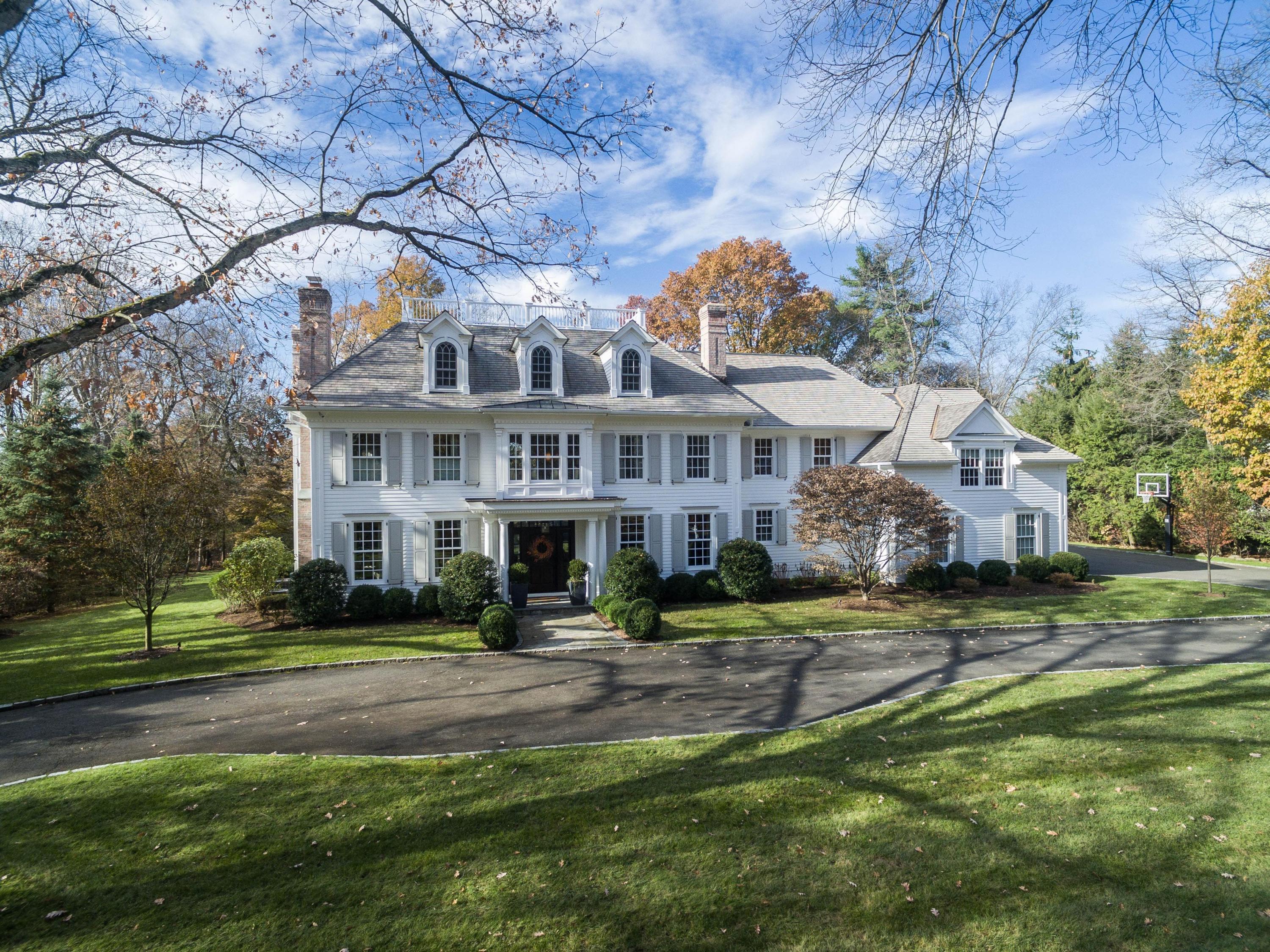 48 Leeuwarden Road Darien, CT 06820 - Photo 3 of 35 a view of a big house with a big yard and large trees