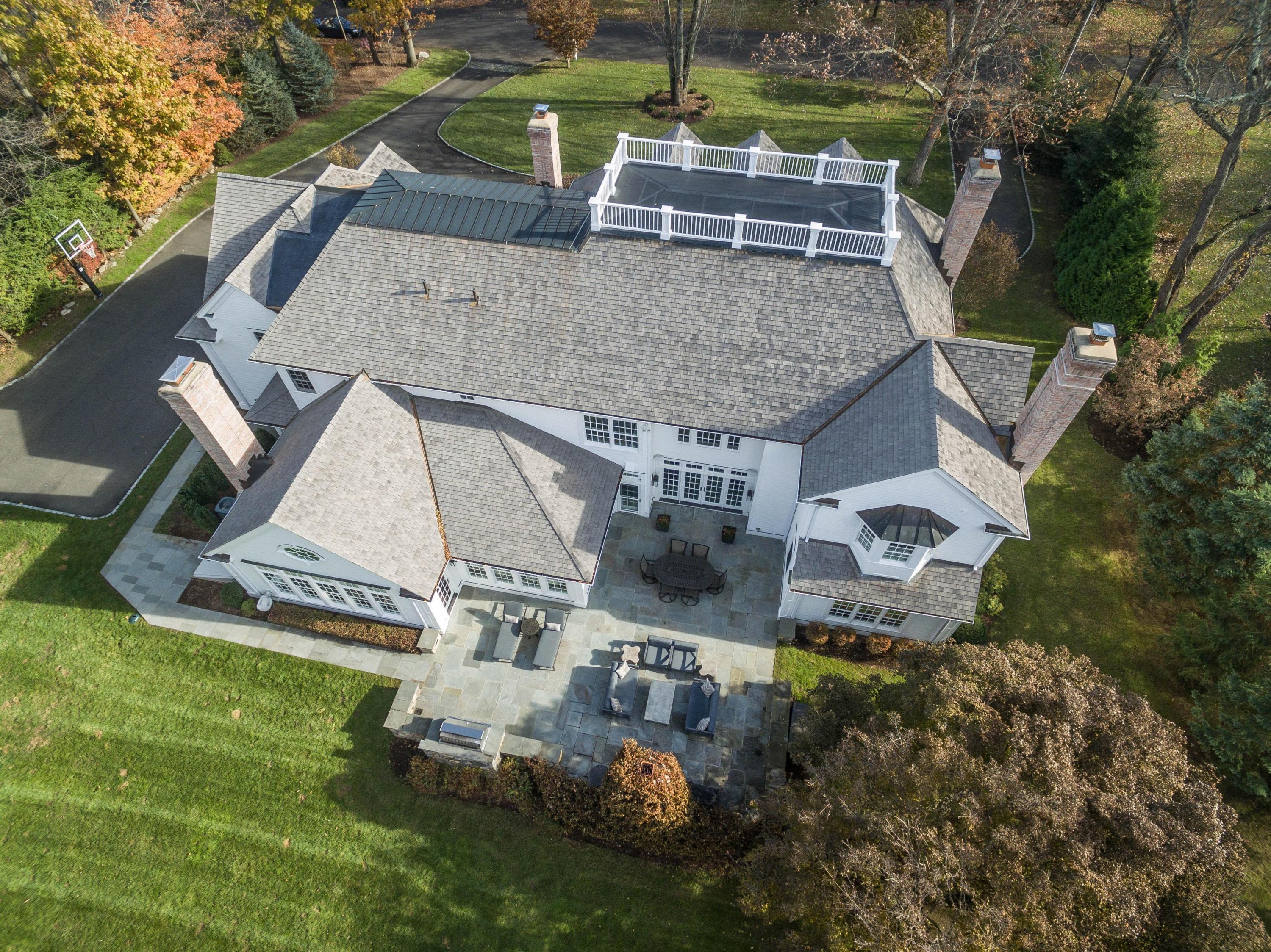 48 Leeuwarden Road Darien, CT 06820 - Photo 34 of 35 an aerial view of a house with garden space and street view