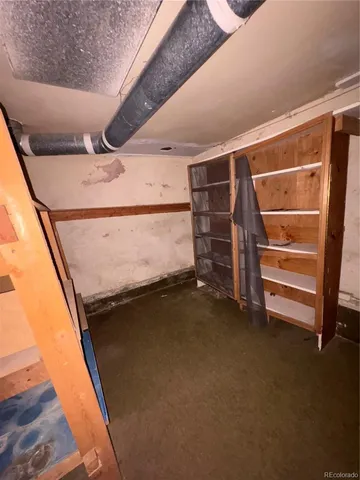 a view of an empty room with a building