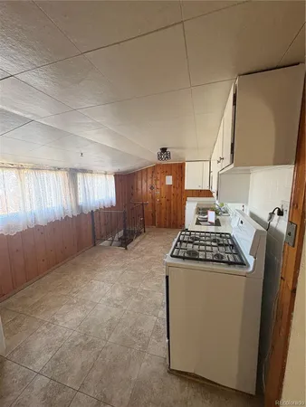 a kitchen with a stove and a refrigerator