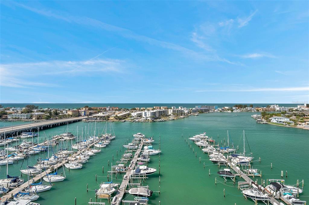 9525 Blind Pass Road, Unit 1103 St. Pete Beach, FL 33706 - Photo 1 of 1 an aerial view of a city with houses