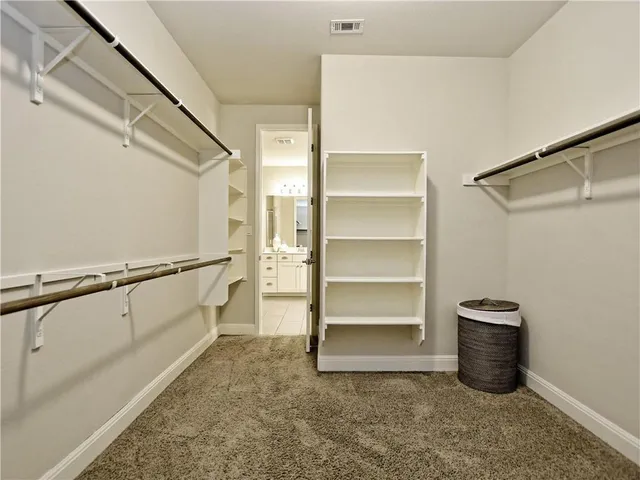 a view of an empty walk in closet