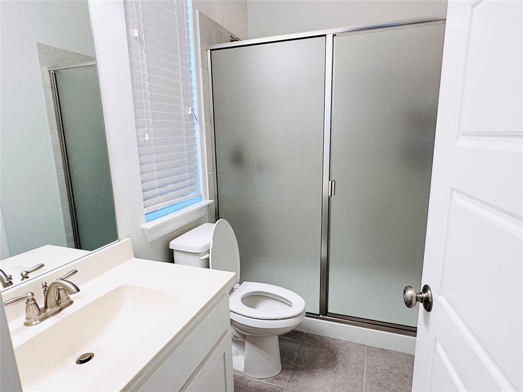 806 Davids Way Allen, TX 75013 - Photo 11 of 24 a bathroom with a sink a toilet and shower