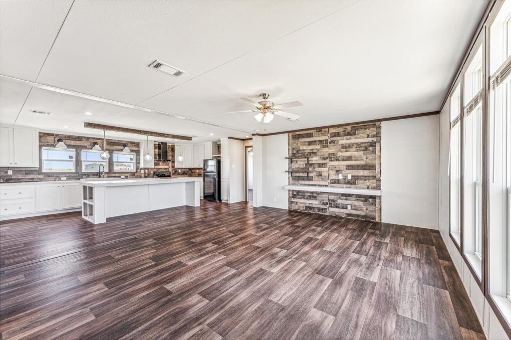 1025 Clear Spring Road Stephenville, TX 76401 - Photo 1 of 1 a view of a kitchen with wooden floor and a kitchen