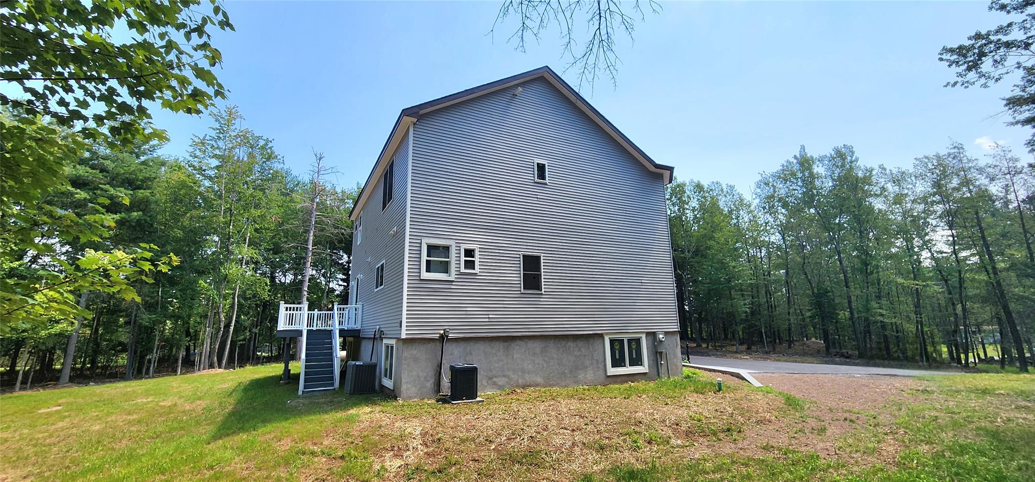 57 Haddock Road Monticello, NY 12701 - Photo 13 of 46 a front view of a house with garden