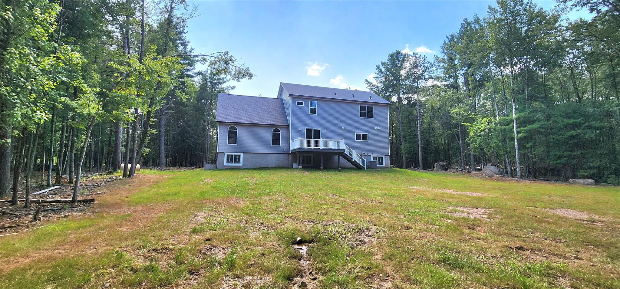 57 Haddock Road Monticello, NY 12701 - Photo 15 of 46 a view of a house with backyard and trees